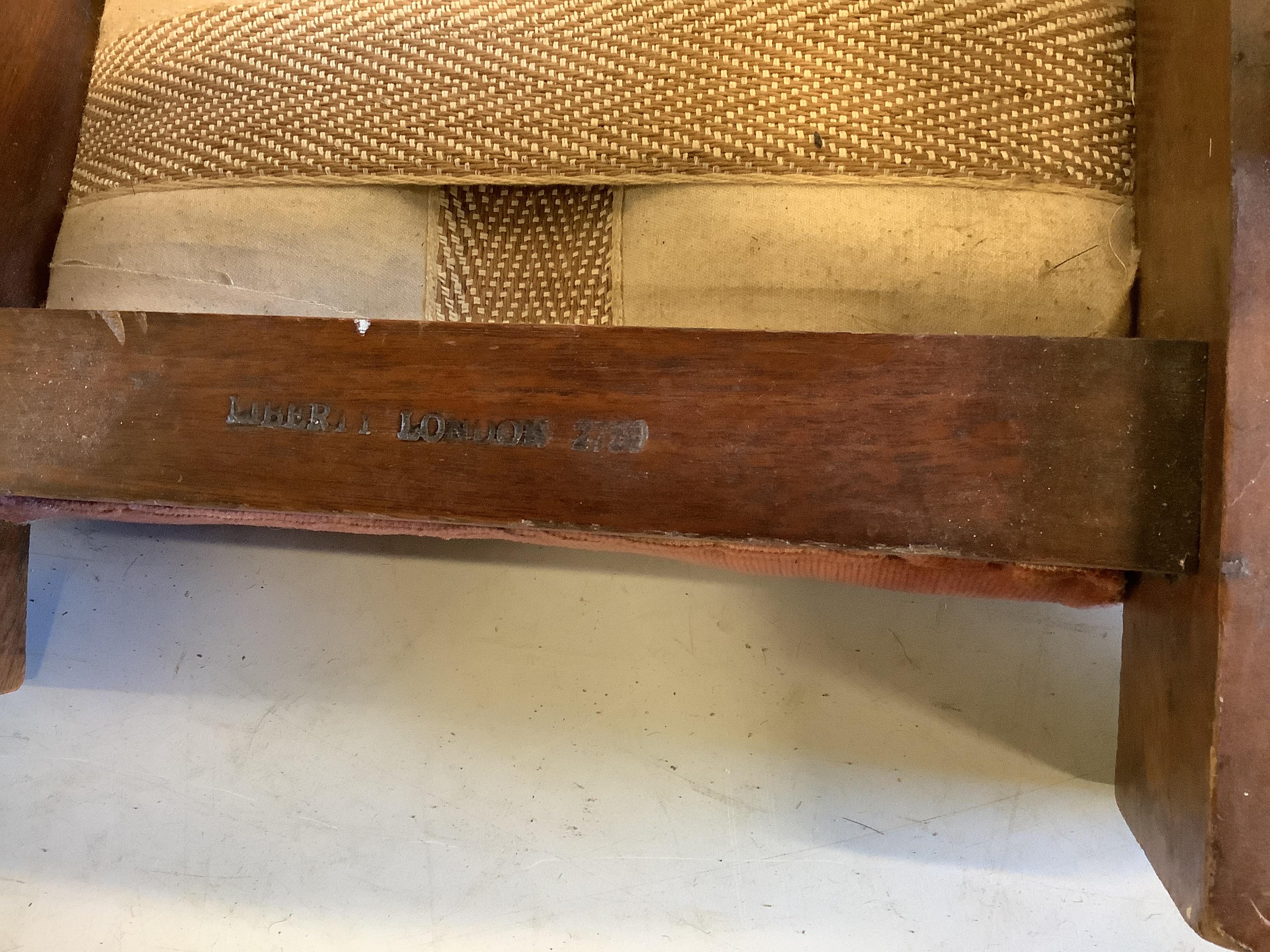 A Liberty chip carved stool, dated 1893, width 56cm, height 34cm